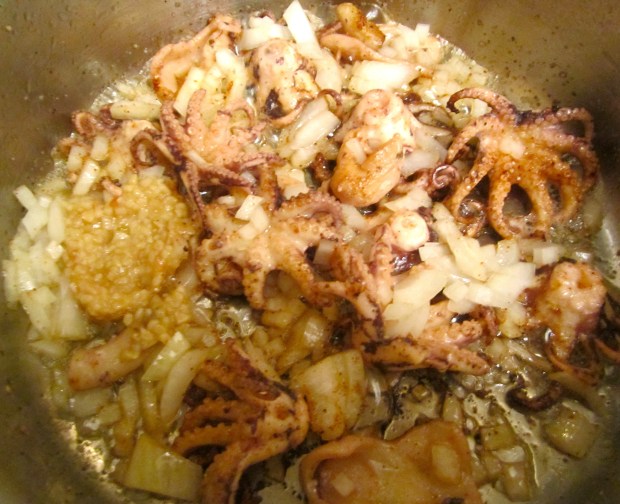 Add finely diced onions and garlic paste. Saute until fragrant