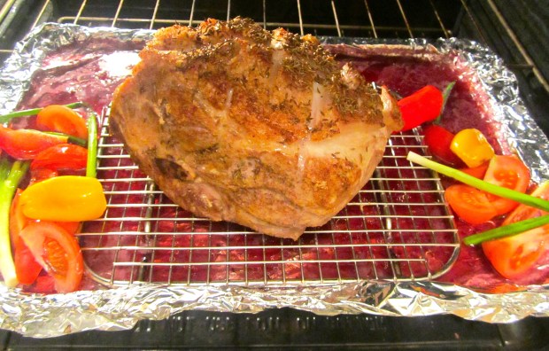 Place on a rack above red wine and beer, add chilies, scallions and tomatoes, roast at 420 F for 30 minutes, turn down to 270F cook for three hours