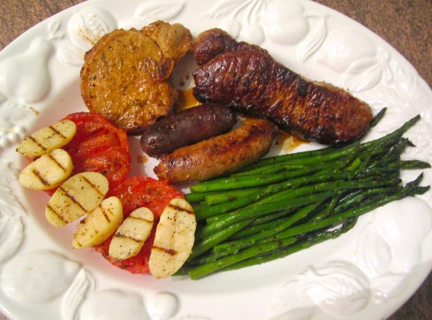 grilled strip steak, pork chop, morcilla, chorizo, tomato, asparagus, tomato