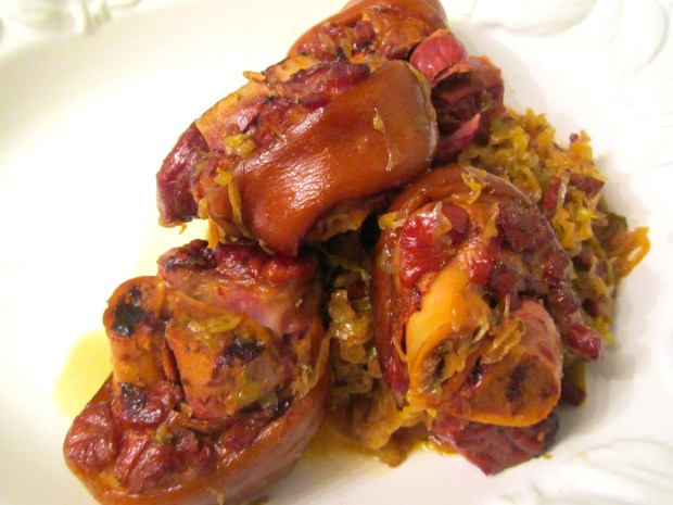 Once the pork knuckles are very tender without falling apart, remove from stock and bury in the cabbage. Let cool and store overnight in fridge. Next day, reheat and serve with sauteed parsley potatoes. Serve with mustard and horseradish