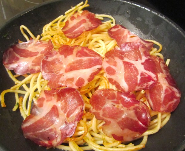 top with very thinly sliced capicola (copa ham)