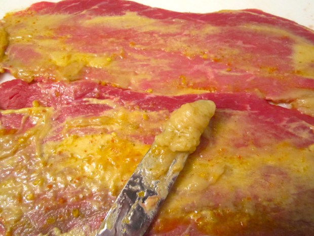 spread garlic paste, bread with flour, egg and  bread crumbs