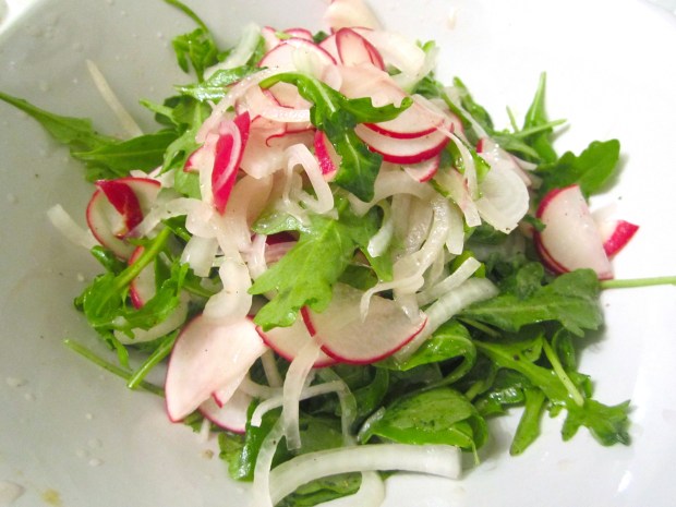 arugula with radish and onions in balsamic vinaigrette