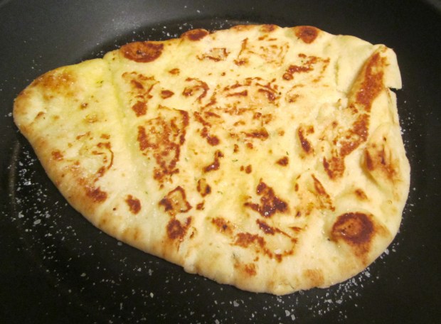 bake naan until golden, brush with butter and sprinkle with sea salt