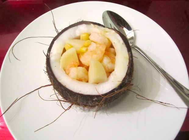 spoon shrimp, potato and corn into clean coconut, spoon soup on top and sprinkle with chopped cilantro 