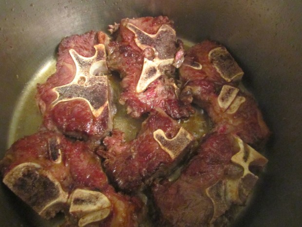 saute beef neck bones, seasoned with kosher salt and black pepper, in peanut oil until browned