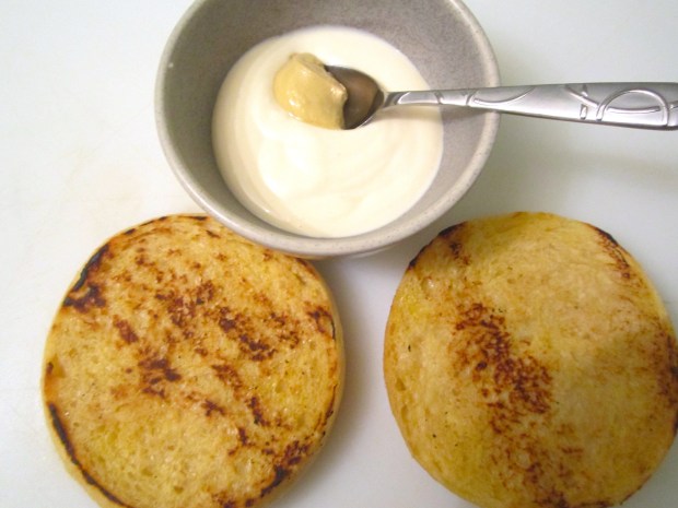 toast thick slices of sour dough bread on bothe sides, mix bechamel with grey poupon mustard