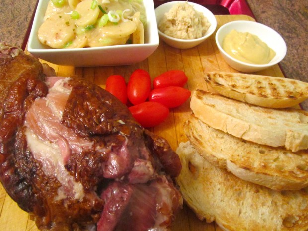 Smoked Pork Shank, German Potato Salad, Pickled Tomatoes, Grilled Italian garlic Bread, Dijon Mustard, Fresh Horseradish