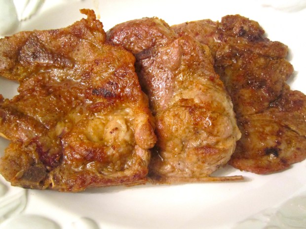 arrange steaks on serving platter, top with sauteed tomatoes and chives