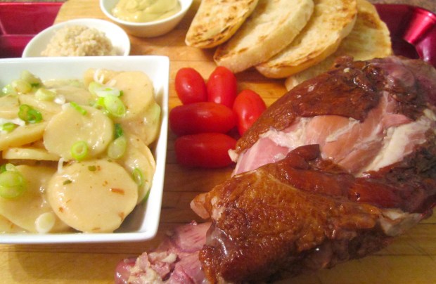 Smoked Pork Shank, German Potato Salad, Pickled Tomatoes, Grilled Italian garlic Bread, Dijon Mustard, Fresh Horseradish