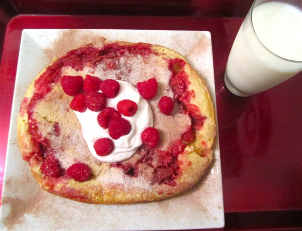 to serve, sprinkle with powdered chocolate and sugar, top with raspberry yogurt and more fresh raspberries