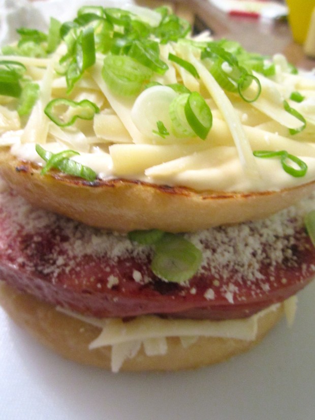 top with second slice of bread, sprinkle with scallions or herbs of your choice