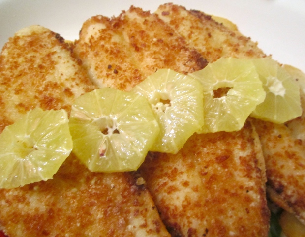top fish filets with peeled, sliced lemon