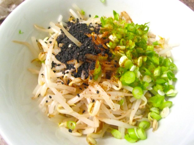 add sliced scallions, season with kosher salt, cayenne pepper, soy sauce, sesame seeds, sesame oil