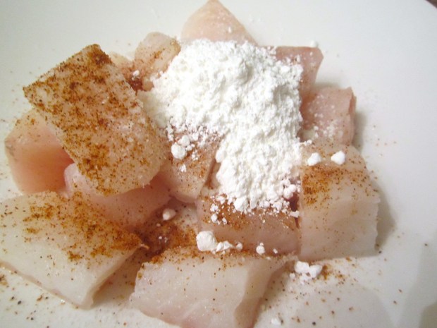 cut sea bass into large cubes, marinade with five spice powder, kosher salt and cayenne pepper, dust with rice flour, mix well