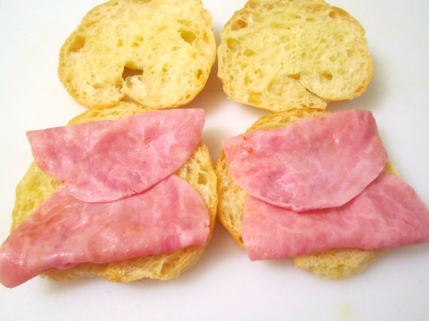 saute ham in garlic oil, top two croissant halves with ham