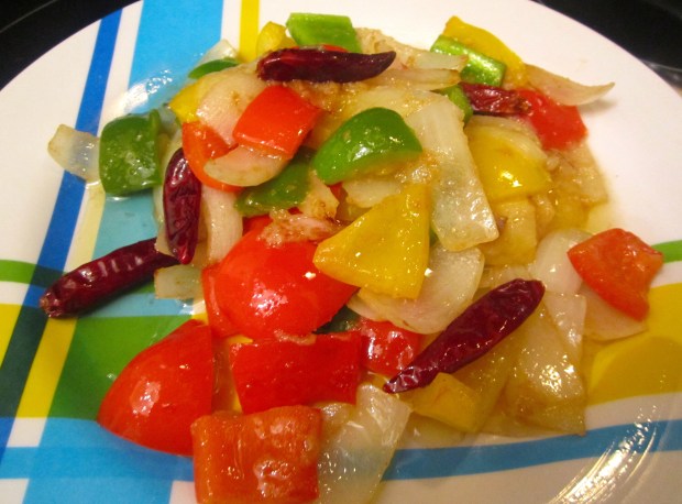 reserved sauted onions, peppers, scallions and chilies