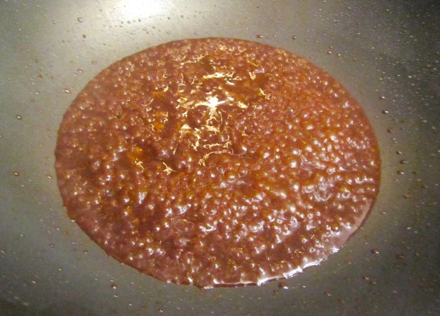 add soy sauce, black bean sauce, chili sauce and rice wine to wok, simmer for one minute