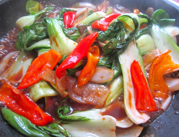 add oyster sauce, soy sauce, sriracha and sesame oil, simmer until bok choy is heated through, check / adjust seasoning