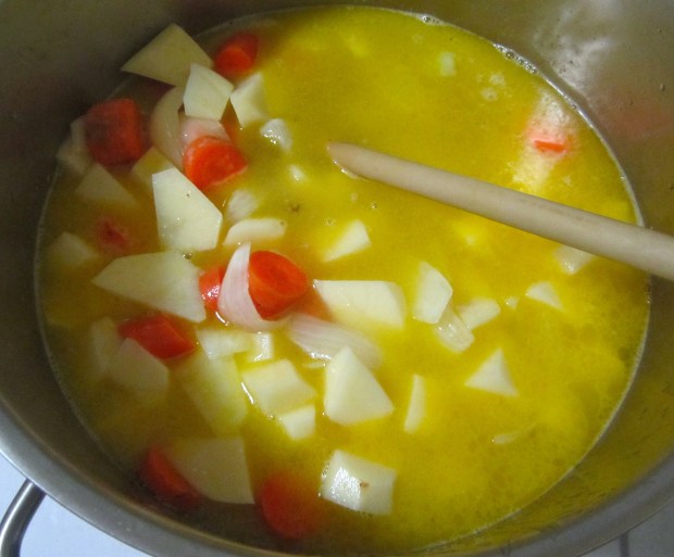 add white wine and chicken stock, season with kosher salt and cayenne pepper