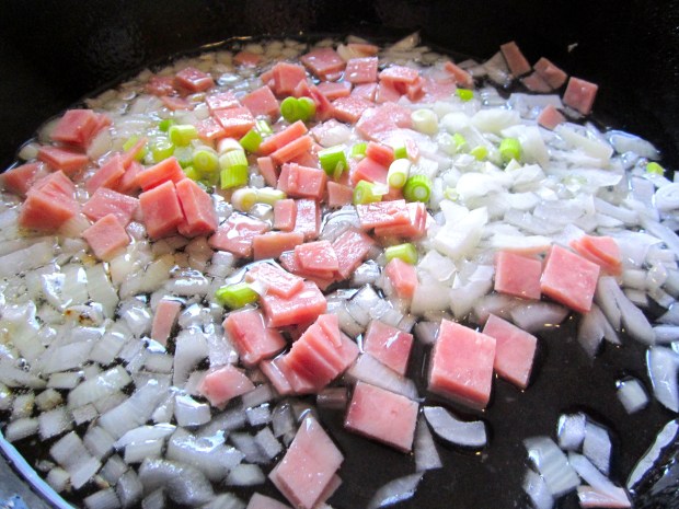 saute onions, scallions, garlic paste (lot's of it)and ham in olive oil (replace the ham with mushrooms for a vegetarian version)
