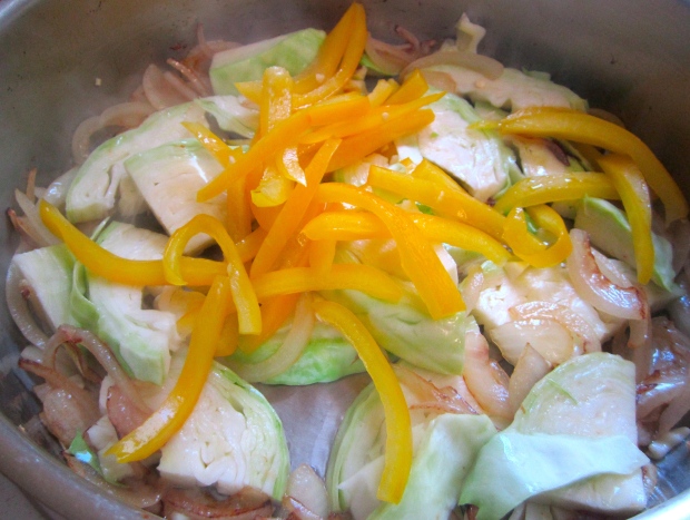 add cabbage and peppers, saute until cabbage starts to wilt