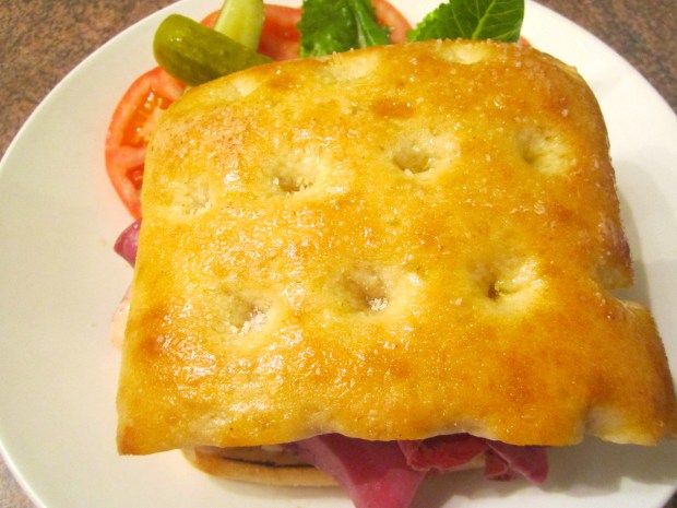 top with the other half of the ciabatta, slice in half