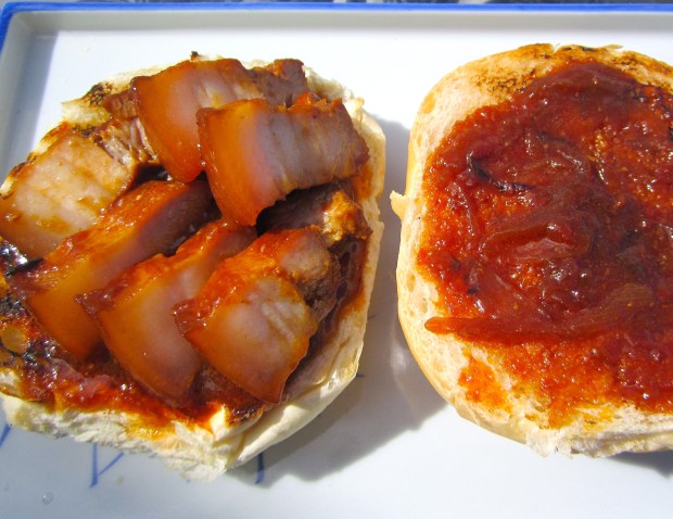 add pork to bottom half of bun