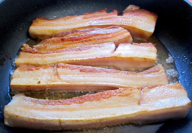 when brown, remove pork and set aside