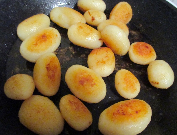 saute blanched small potatoes in olive oil, season with kosher salt and cayenne pepper