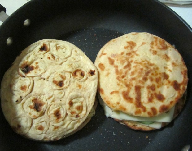 cook slowly on both sides until cheese has melted