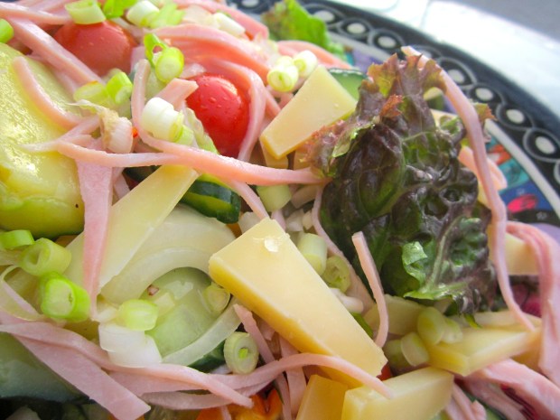 Salad with asiago cheese and bologna in dijon vinaigrette