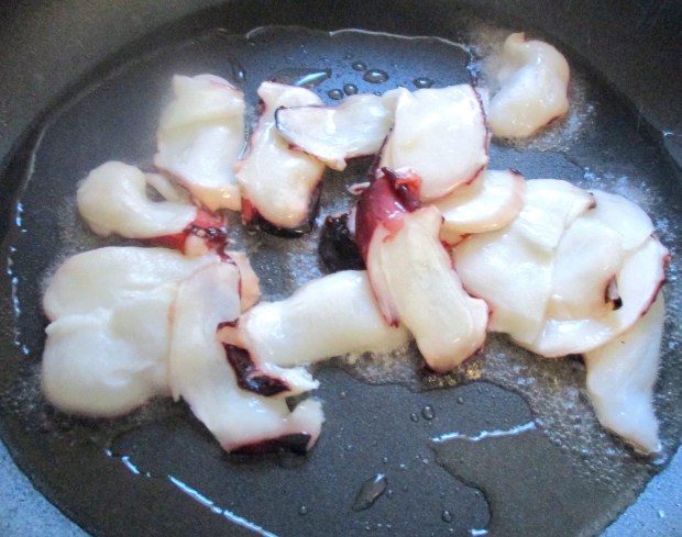 season octopus with kosher salt and chili oil, saute in VERY HOT pan with garlic oil for about 3 seconds, remove from pan, set aside