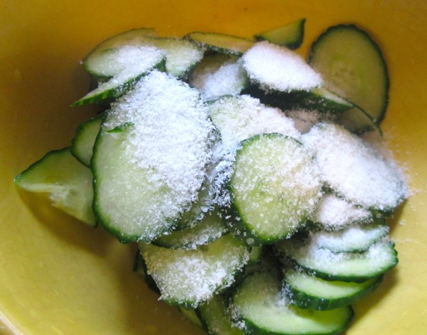 season sliced cucumbers generously with salt, let sit for 15 minutes, squeeze and discard excess liquid