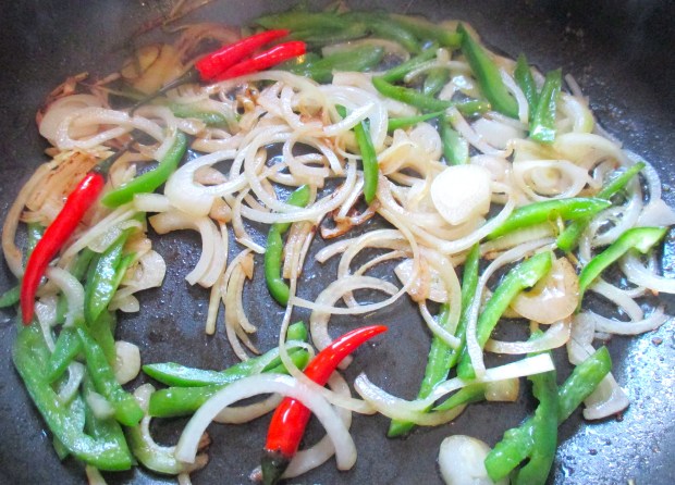 saute onion, green peppers and red chilies in garlic oil
