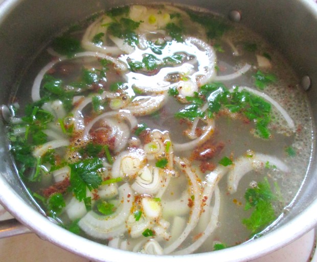 add sausages, onions and plenty of italian parsley to a strong pork stock, simmer for one hour, season with kosher salt and black pepper, check / adjust seasoning