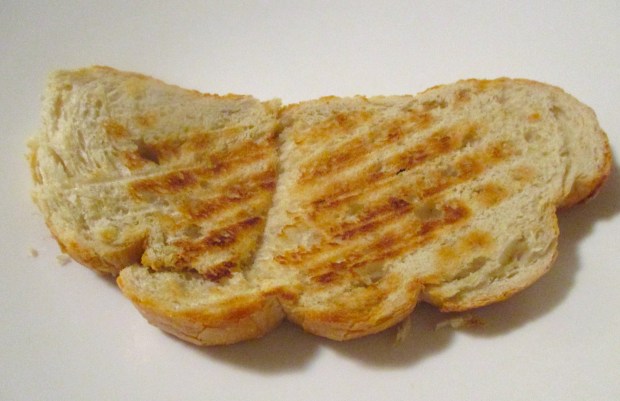 plate a thick slice of grilled sour dough bread