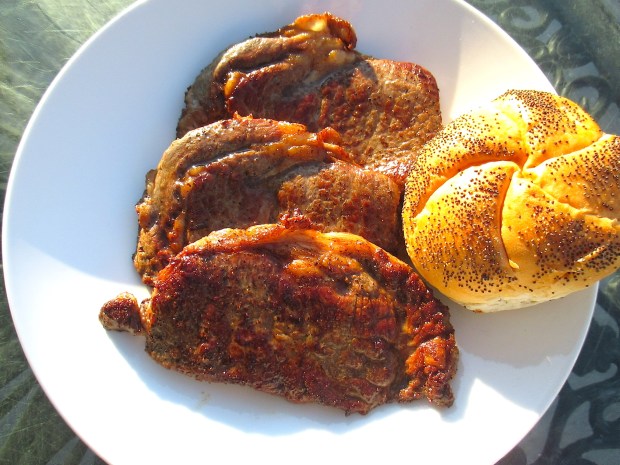 plate steaks and rustic bread to mop up the sauce and juices
