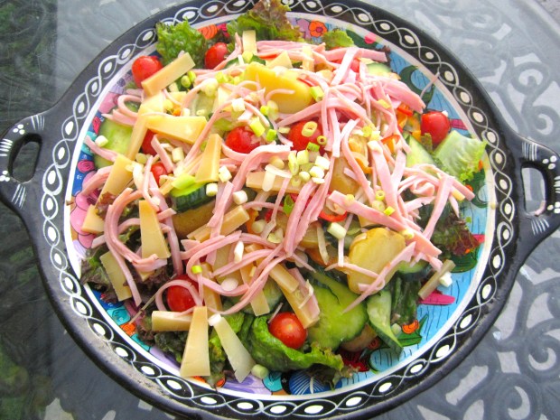 Salad with asiago cheese and bologna in dijon vinaigrette