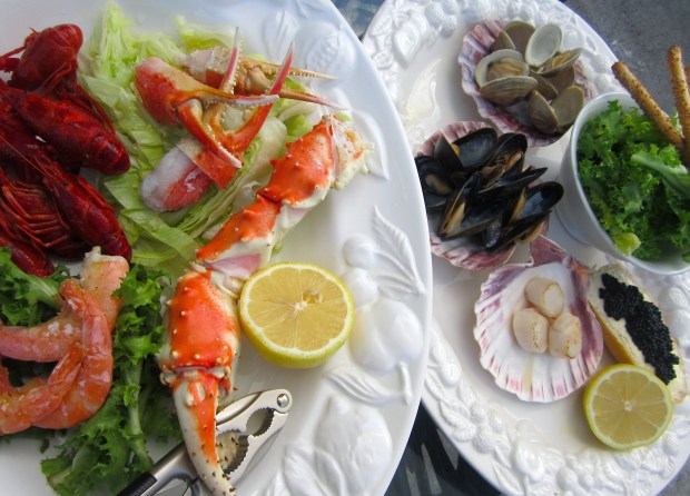 Seafood Salad - lettuce in lime vinaigrette, endive in lime vinaigrette, grissini, lemon, caviar on sour dough bread, mussels, clams, shrimp. king crab, snow crab, crayfish, scallops