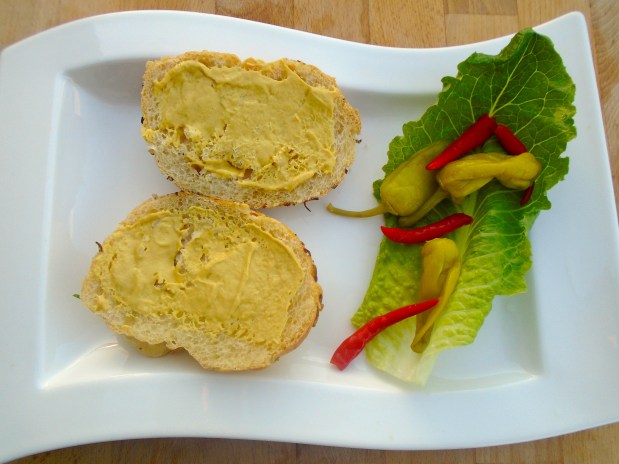 spread dijon mustard on 2 garlic/onion rolls