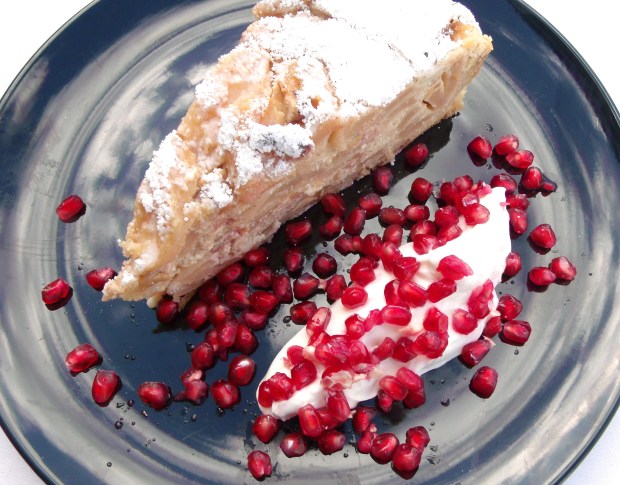 Ricotta Cheese Cake With Apples And Cashews, Served With Greek Yogurt And Pomegranate Seeds